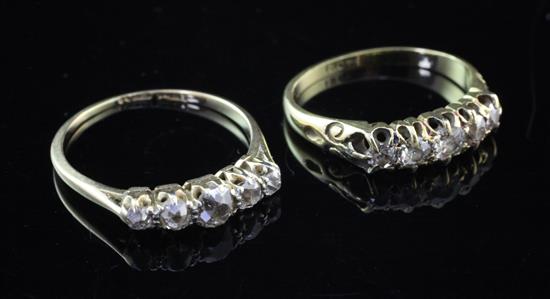 Two Edwardian 18ct gold and five stone graduated diamond rings, sizes K & O.